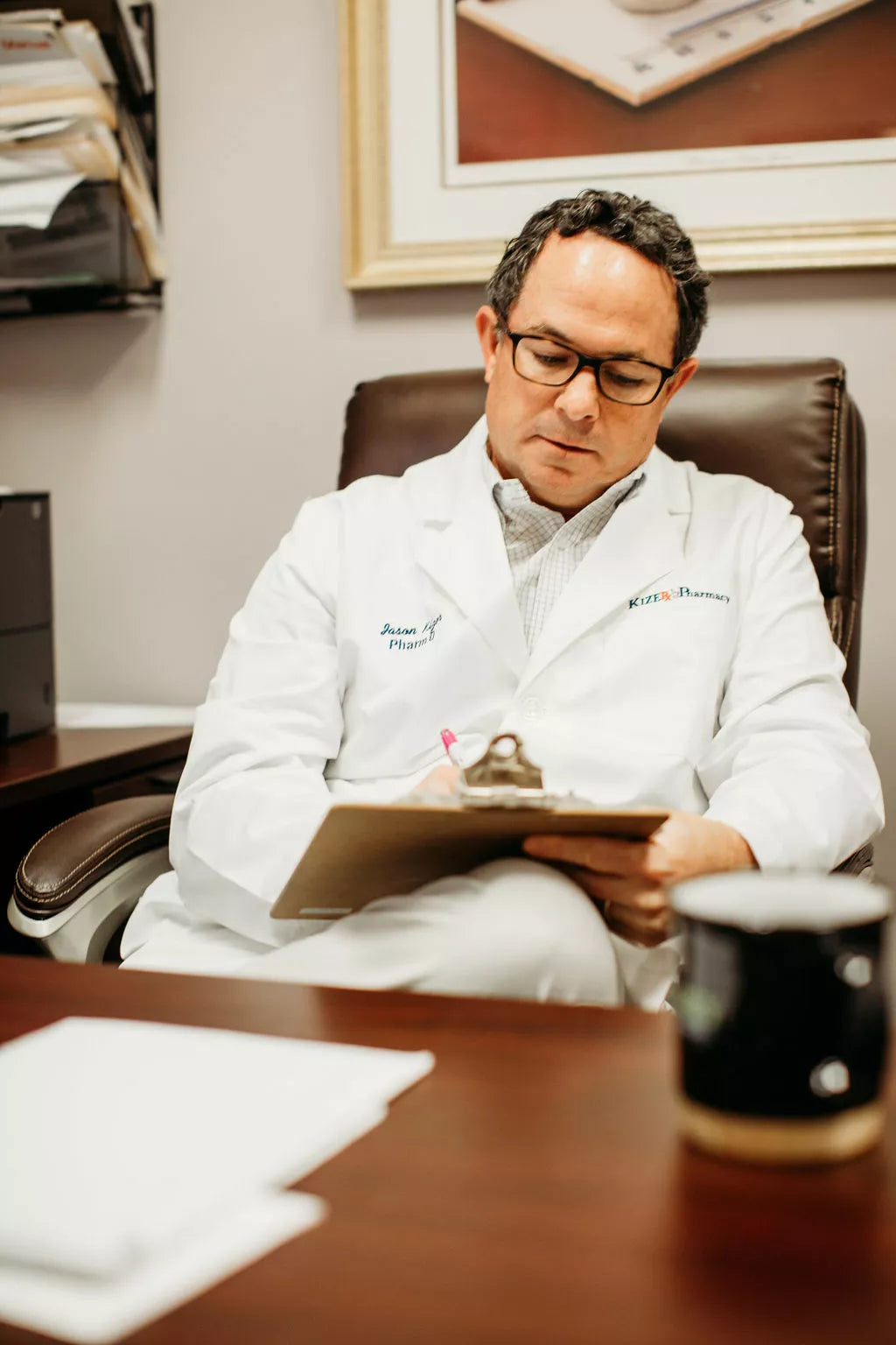 Functional medicine practitioner reviewing supplement recommendations with a patient during a consultation