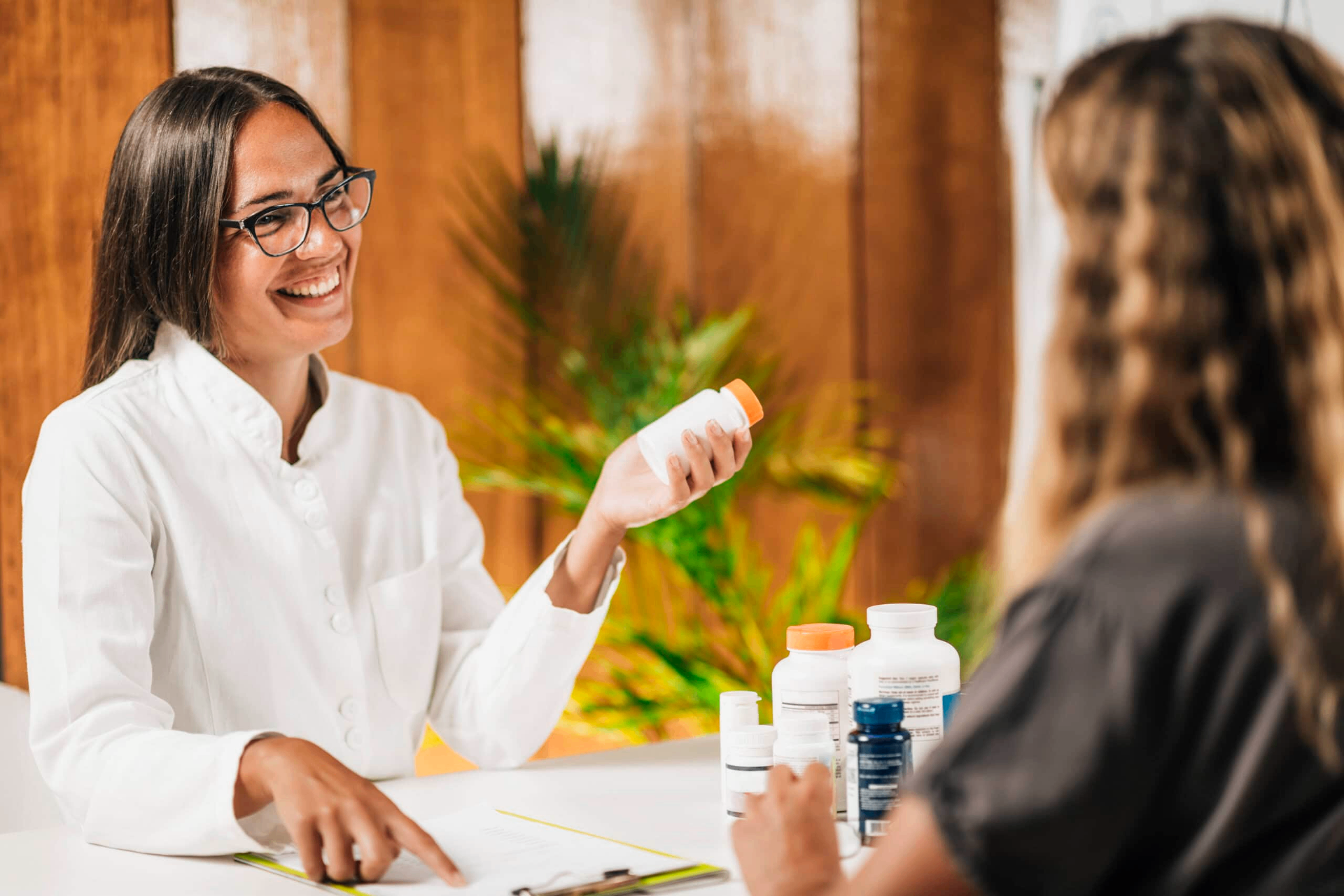 Pharmacist reviewing supplement options with a patient
